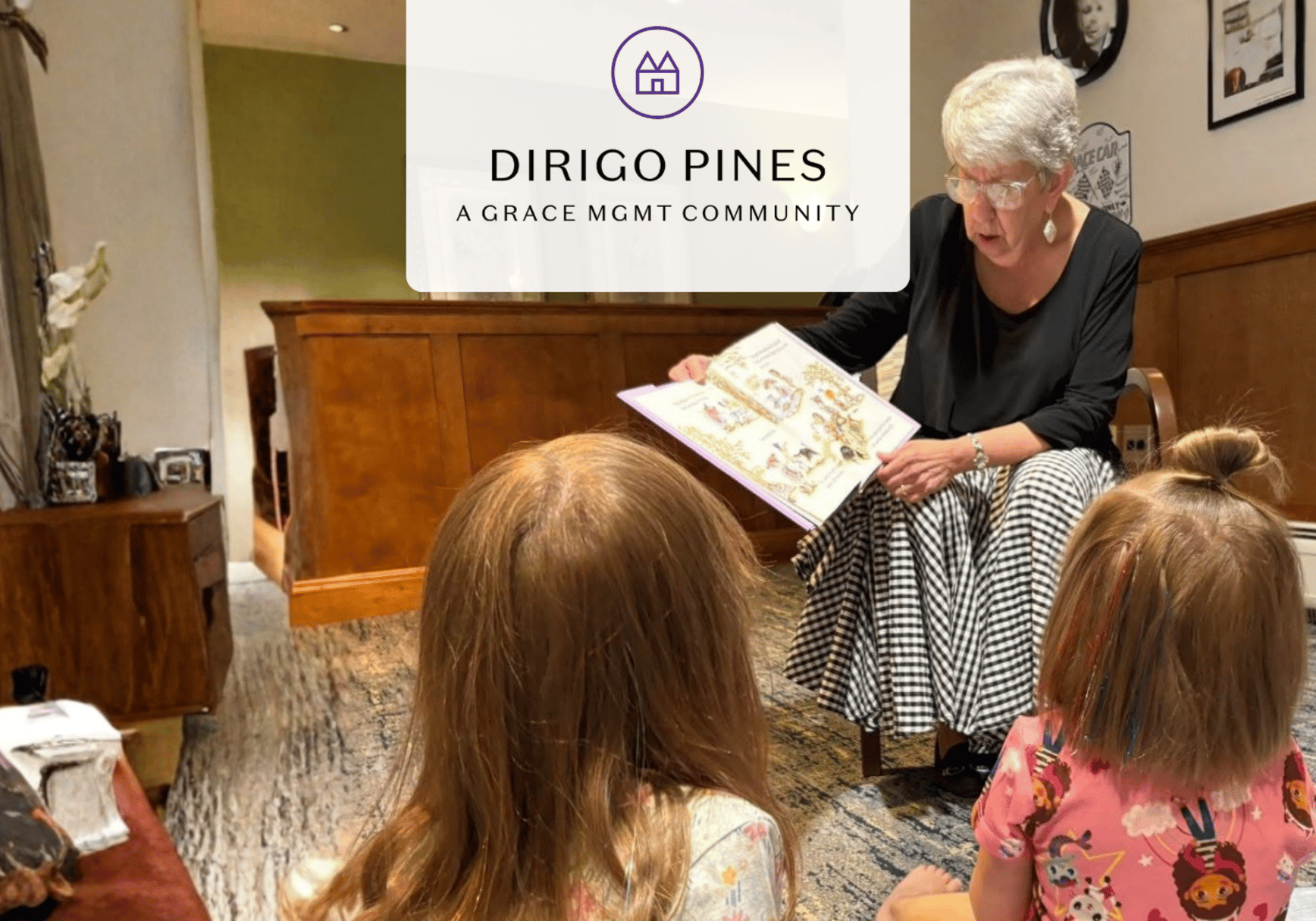 Older woman reads a colorful picture book to seated children in a cozy room; a Dirigo Pines logo overlay is visible above.