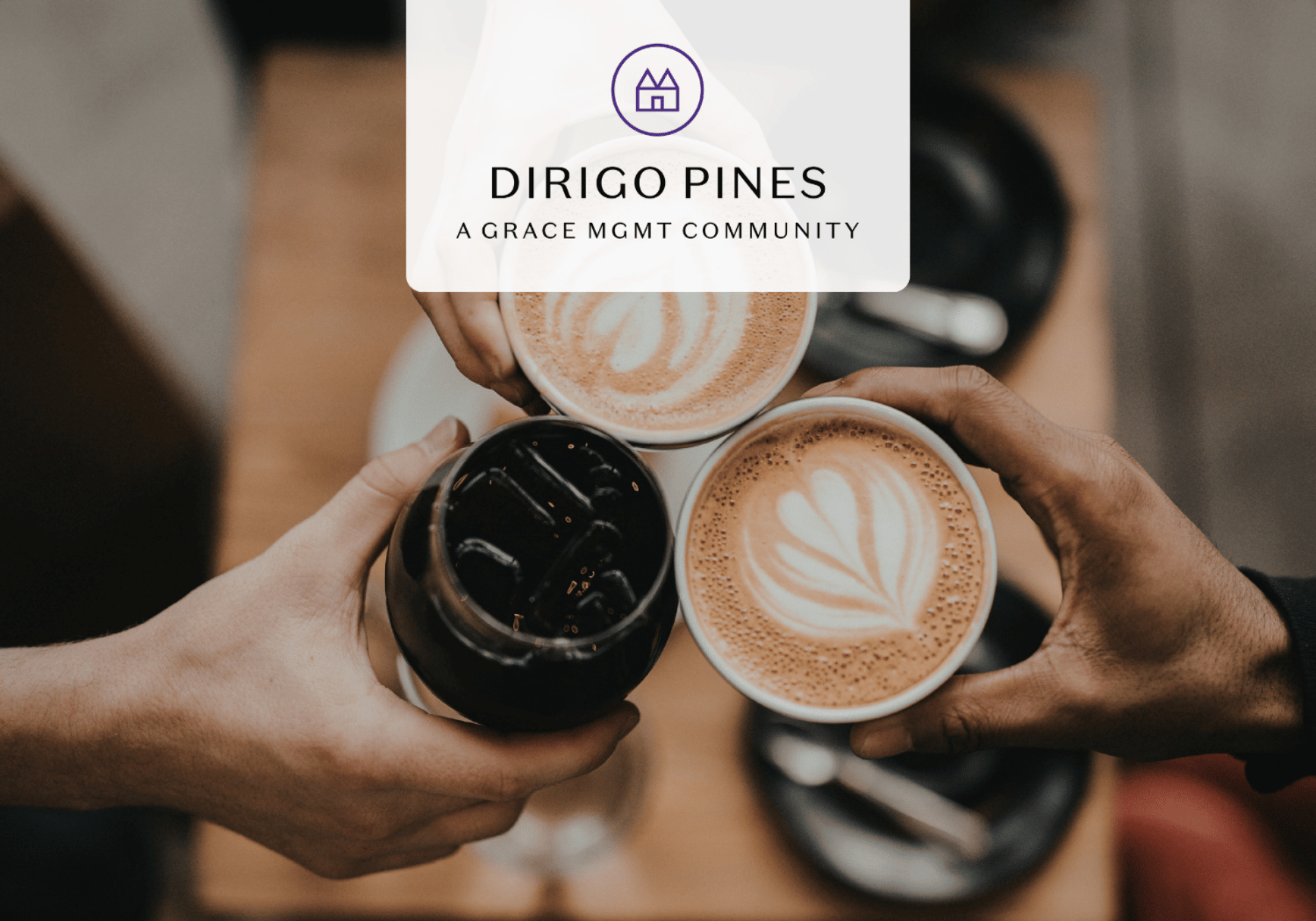 Three people clinking coffee cups with latte art, used as a hero image for Dirigo Pines community branding