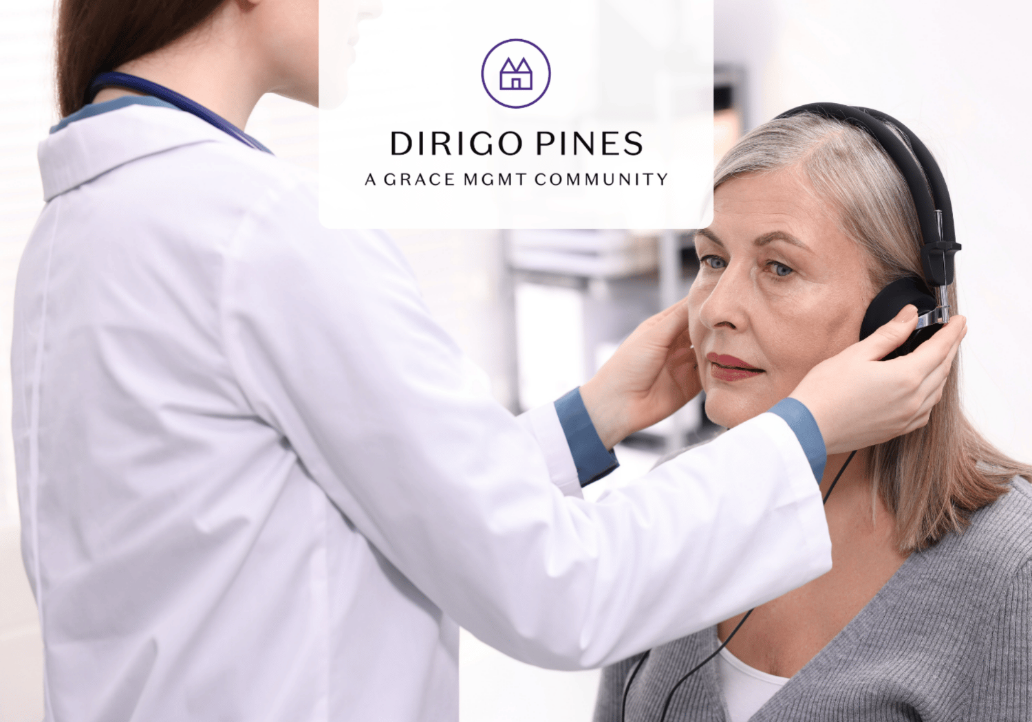 Healthcare professional fits a headset on an older woman for a telehealth/remote consultation.